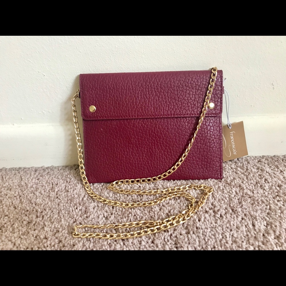 Francesca’s deep red envelope clutch
